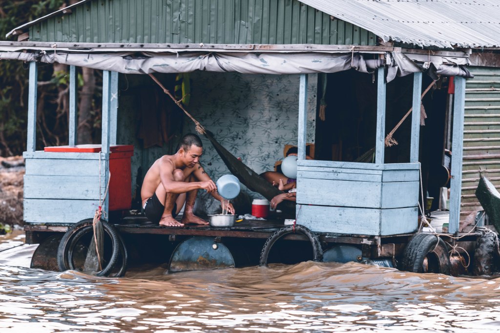 A family isolated in a building due to flood which shows why flood management is important
