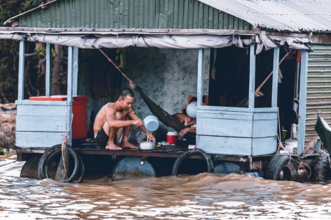 A family isolated in a building due to flood which shows why flood management is important