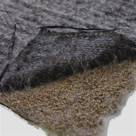 Close-up of a geotextile material, showcasing its woven and non-woven layers, used for soil separation and filtration in civil engineering applications.