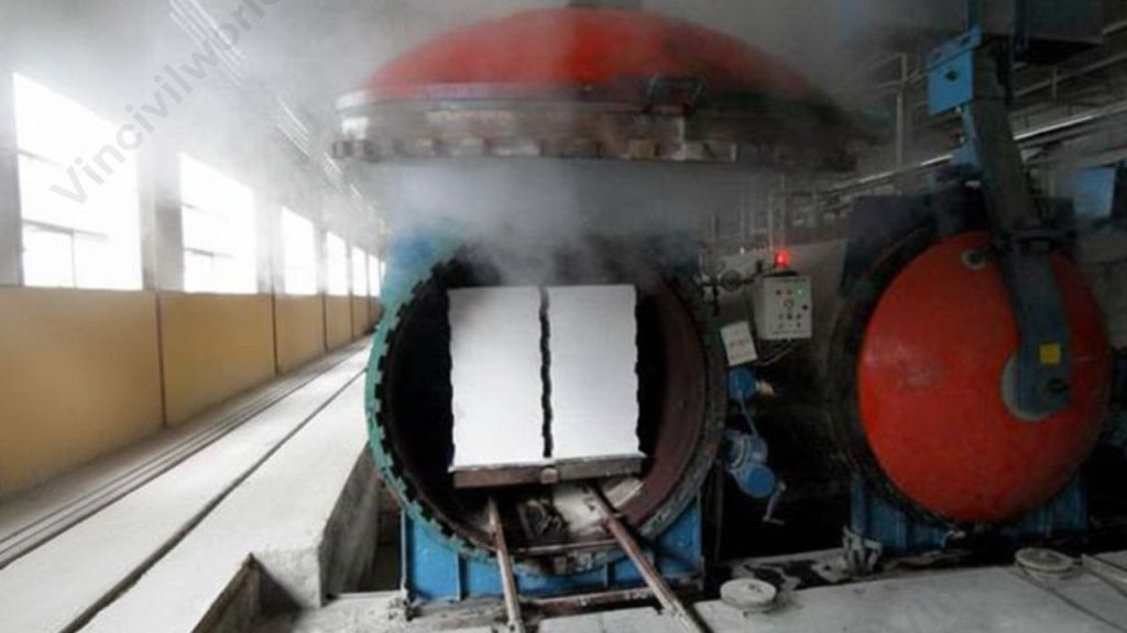 A steam curing chamber used for concrete, showcasing steam release and a partially visible concrete element inside.